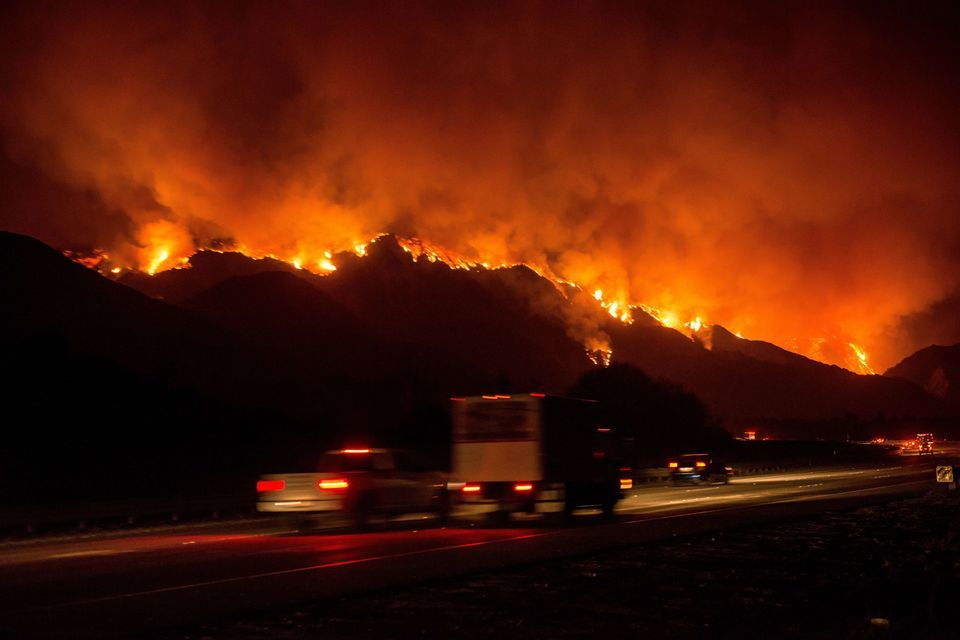 CALIFORNIA, USA - DECEMBER 5: The Thomas Fire crests a mountain near Lake Casitas on December 5, 2017 in Ventura, California, United States. The fire has consumed over 50,000 acres according to the California Department of Forestry and Fire protection. Justin L. Stewart / Anadolu Agency