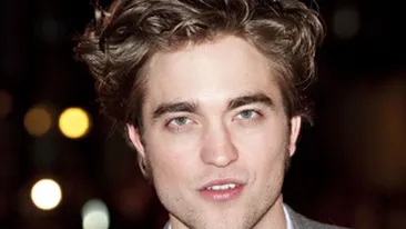 Robert Pattinson i-a cumparat o chitara unui cersetor!