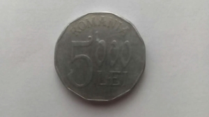 Mai ții minte celebra monedă de 5.000 lei din anul 2002?! Cu ce preț se vinde acum, în martie 2023