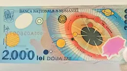 Cât se oferă acum pe bancnota de 2.000 de lei cu eclipsa din 1999. Unele exemplare ajung la sume colosale