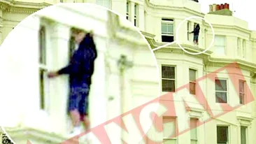 Un hot a stat sapte ore agatat de o fereastra