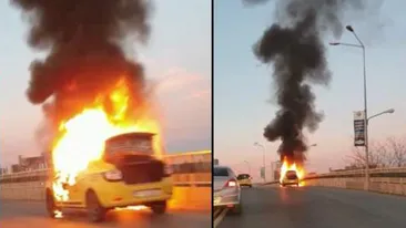 Panică pe podul Pipera din Capitală. Un taxi a luat foc în mers