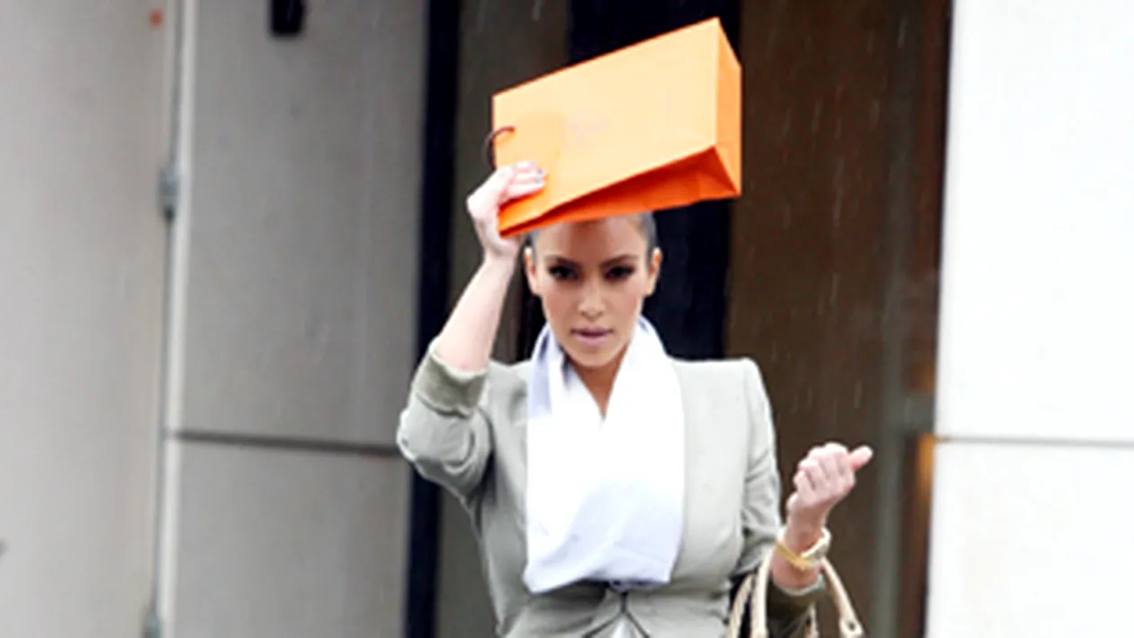Kim Kardashian si-a pus punga in cap sa n-o ude ploaia