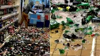 Scene șocante într-un supermarket. O femeie a spart 500 de sticle de alcool