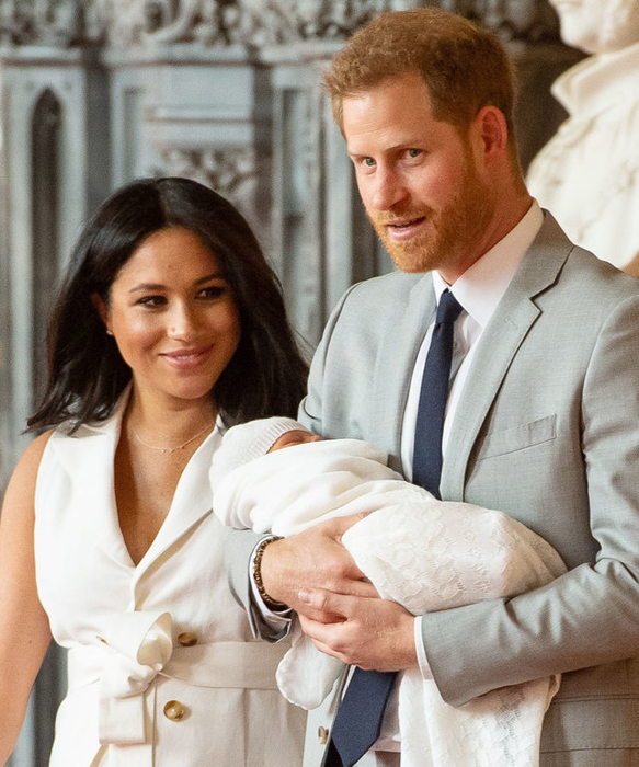 WINDSOR, ENGLAND - MAY 08: Prince Harry, Duke of Sussex and Meghan, Duchess of Sussex, pose with their newborn son Prince Archie Harrison Mountbatten-Windsor during a photocall in St George's Hall at Windsor Castle on May 8, 2019 in Windsor, England. The Duchess of Sussex gave birth at 05:26 on Monday 06 May, 2019. (Photo by Dominic Lipinski - WPA Pool/Getty Images)