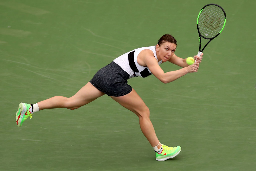 DUBAI, UNITED ARAB EMIRATES - FEBRUARY 19: Simona Halep of Romania plays a shot in her match against Eugenie Bouchard of Canada during day three of the WTA Dubai Duty Free Tennis Championships at Dubai Tennis Stadium on February 19, 2019 in Dubai, United Arab Emirates. (Photo by Francois Nel/Getty Images)