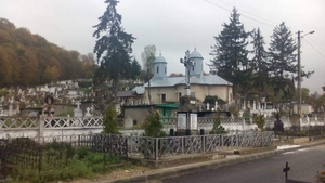 Scandal cu focuri de armă în cimitirul din Moreni. Preotul s-a certat cu doi enoriași