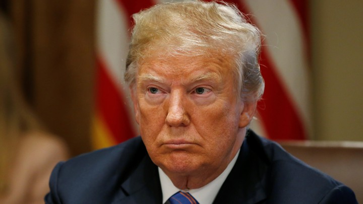 U.S. President Donald Trump listens during a cabinet meeting at the White House in Washington, U.S., July 18, 2018. REUTERS/Leah Millis - RC1459858650