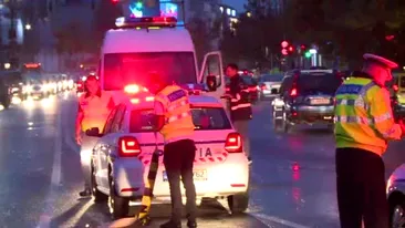 Poliţistă luată pe capotă de un taximetrist, în Capitală. Şoferul a învinovățit-o pe femeie