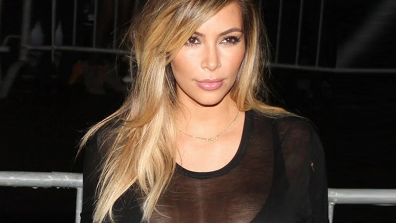 Kanye West ii cara sacosele in timp ce ea... Reactia lui Kim Kardashian cand e filmata de paparazzi