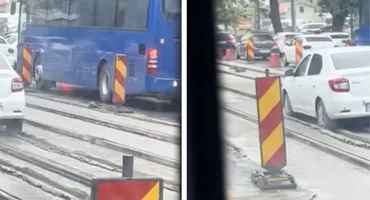 Situație neașteptată pentru un șofer din Capitală! A vrut să scape de ambuteiaj, dar a rămas cu mașina împotmolită în beton