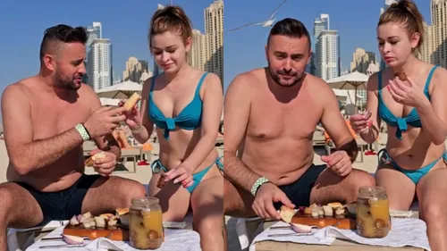 Masă în stil ardelenesc, pe o plajă din Dubai. 2 români au mâncat slănină cu ceapă lângă Burj al-Arab: ”Dacă ne prind aștia, ne bagă la pușcărie”