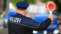 Câţi bani au făcut doi români care se dădeau drept poliţişti în Austria! Au strâns o mică avere, dar...