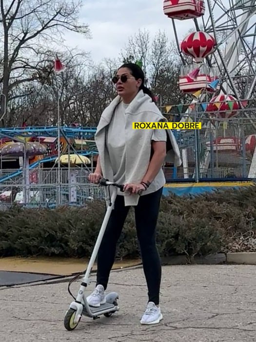 Bruneta a dat în mintea copiilor și s-a plimbat pe trotinetă