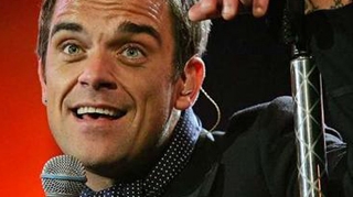 Robbie Williams se simte mai bine! Trupa Take That isi continua turneul, dupa anularea unui show