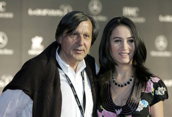 ESTORIL, PORTUGAL - MAY 15: Ilie Nastase and guest arrive at the Laureus/Vogue welcome party on May 15, 2005 at Farol Design Hotel, Estoril, Portugal. (Photo by Clive Rose/Getty Images for Laureus)