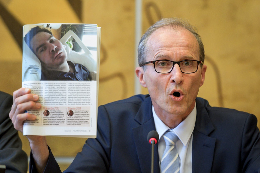 Neurologist and advisor of Vincent Lamber's parent shows a picture of Vincent Lambert who is in a vegetative state since 2008, during an event on the sideline of the United Nations Human Rights Council in Geneva on July 1, 2019. France's highest appeals court said on June 28 that the life support mechanisms keeping a severely brain-damaged man alive can be turned off "from now", a lawyer for his wife said, in the latest legal twist in a landmark right-to-die case., Image: 453161836, License: Rights-managed, Restrictions: , Model Release: no, Credit line: Profimedia, AFP