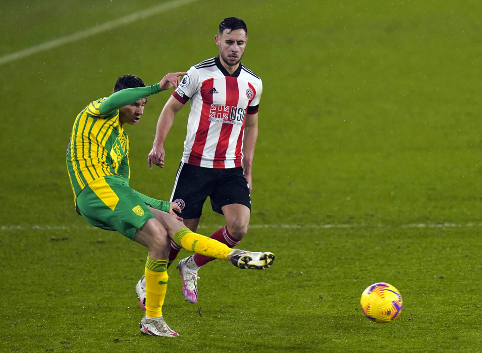 02 February 2021, United Kingdom, Sheffield: West Bromwich Albion's Conor Townsend (L) and Sheffield United's George Baldock in action during the English Premier League soccer match between Sheffield United and West Bromwich Albion at Bramall Lane. Photo: Tim Keeton/PA Wire/dpa