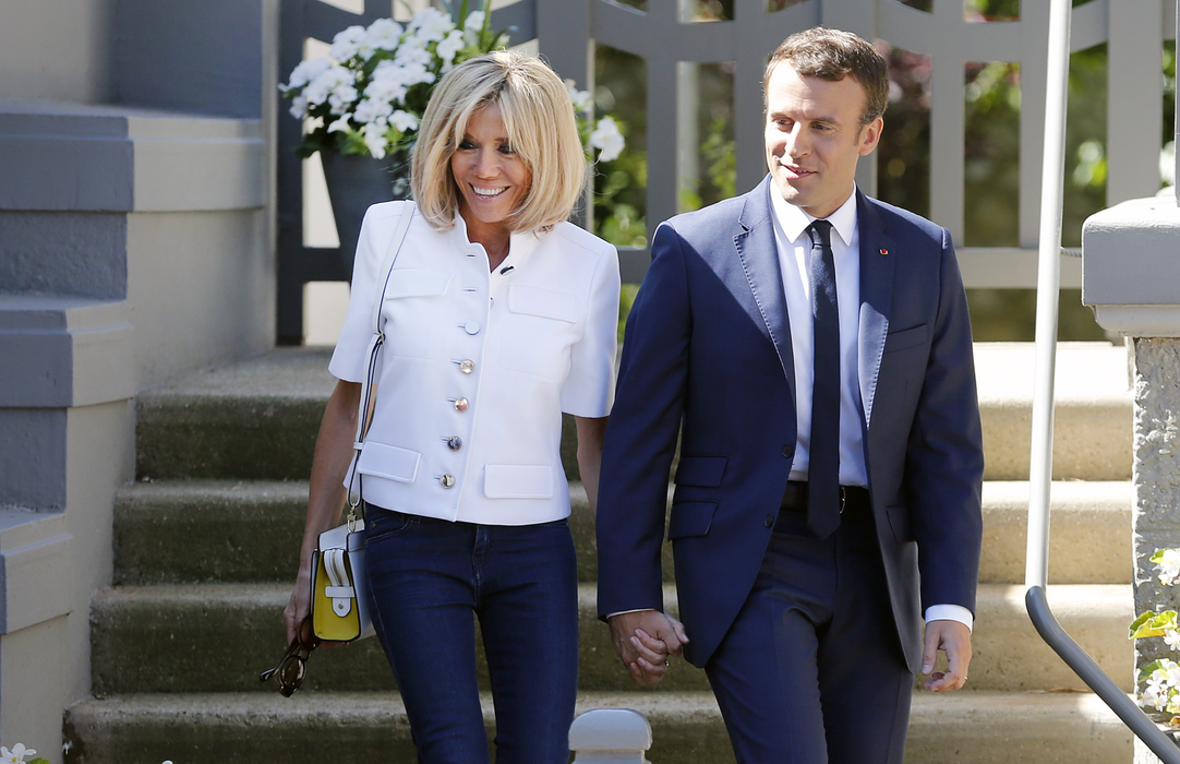LE TOUQUET-PARIS-PLAGE, FRANCE - JUNE 11:  French President Emmanuel Macron and his wife Brigitte Trogneux leave their home prior to their vote at the polling station of the town hall in the first round of the French legislative elections on June 11, 2017 in Le Touquet-Paris-Plage, France. France holds the first round of parliamentary elections on 11 June 2017.  (Photo by Chesnot/Getty Images)